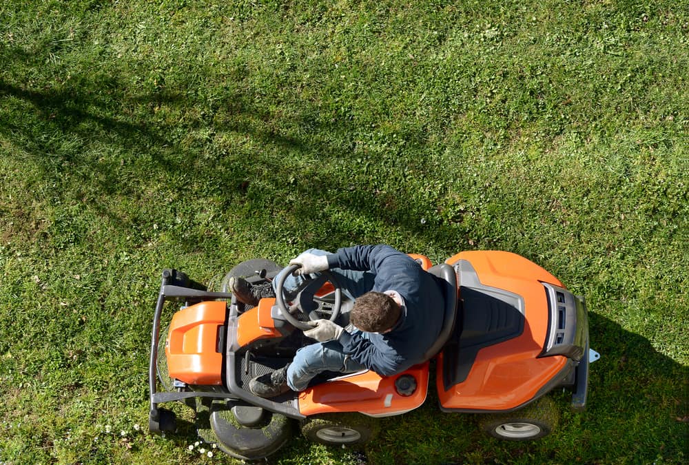 Father's Day gifts: Man on ride-on lawn mower