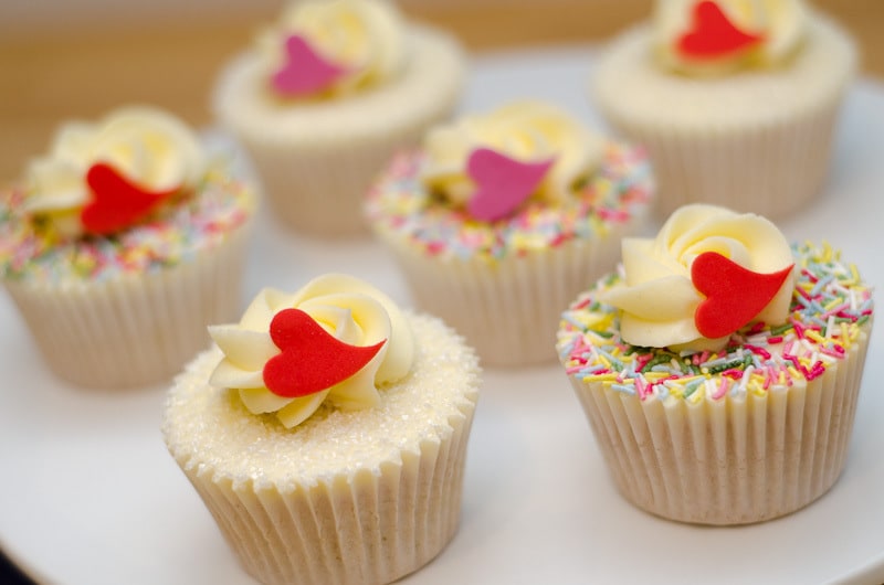 Valentine's Day Cupcakes with white frosting and small heart